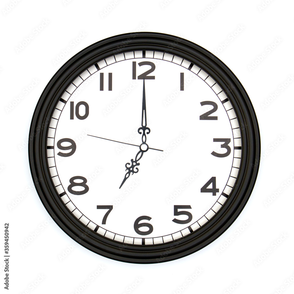 Black round analog wall clock isolated on white background, its seven oclock. Black round analog wall clock isolated on white background, its seven oclock.