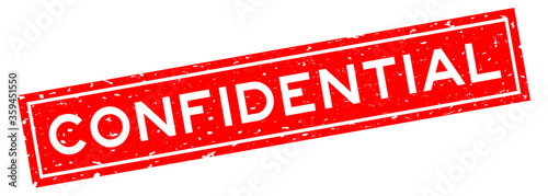 Grunge red confidential word square rubber seal stamp on white background