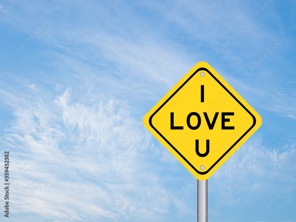 Yellow transportation sign with word I love you on blue sky background Yellow transportation sign with word I love you on blue sky background