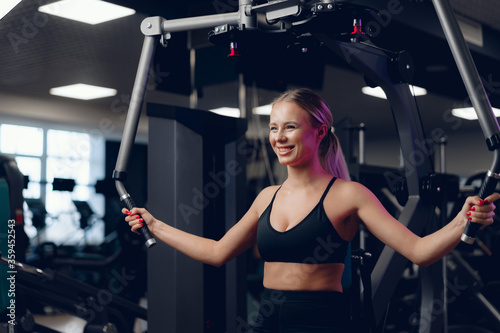 Young caucasian blonde woman training hands in a gym