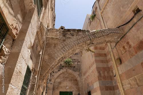 Passage from the Shaar Barzel - Iron Gate - Bab al-Hadid gate to the Little Kotel - Small Wailing Wall in the Arab Quarter in the old city of Jerusalem, Israel photo