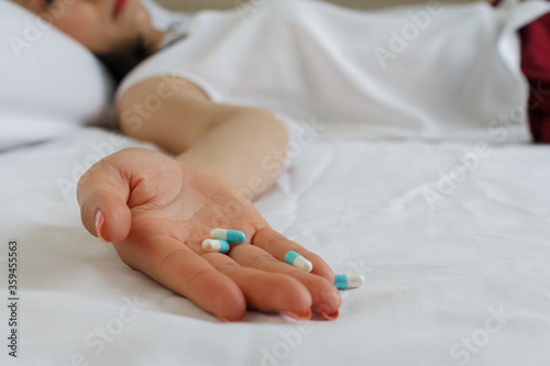 Close up of woman hand with many pills. Drug addiction and social issue for teenager. Take an overdose concept
