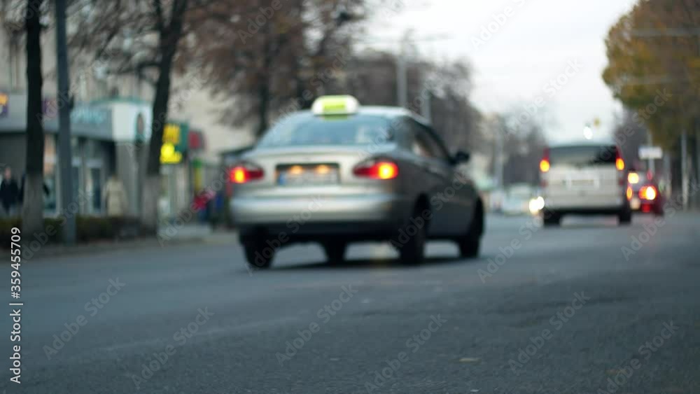 City traffic. Cars are moving on the street road in bokeh City traffic. Cars are moving on the street road in bokeh