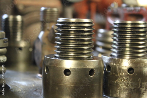 Cylinder Head bolts on a big industrial marine diesel engine on a ship