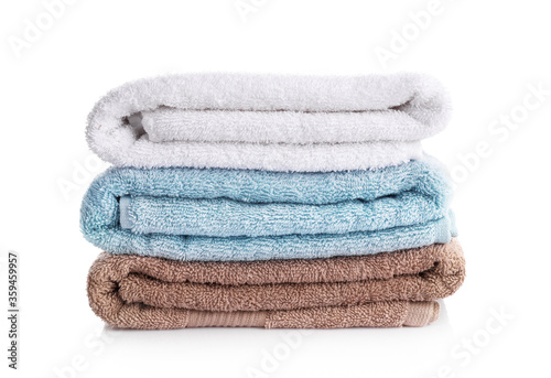 Pile of rainbow colored towels isolated