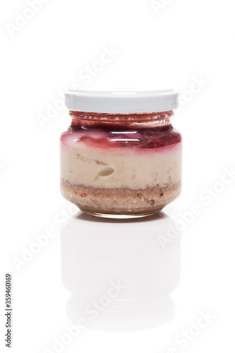 Nutrition concept - Healthy food, Diet, Detox, Clean Eating or Vegetarian concept. A nutritious food on glass jars against white background. Fruit pie in a glass. Dessert