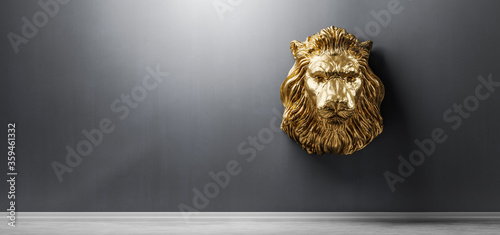 Foto Golden statue of lion, a head sculpture on wall