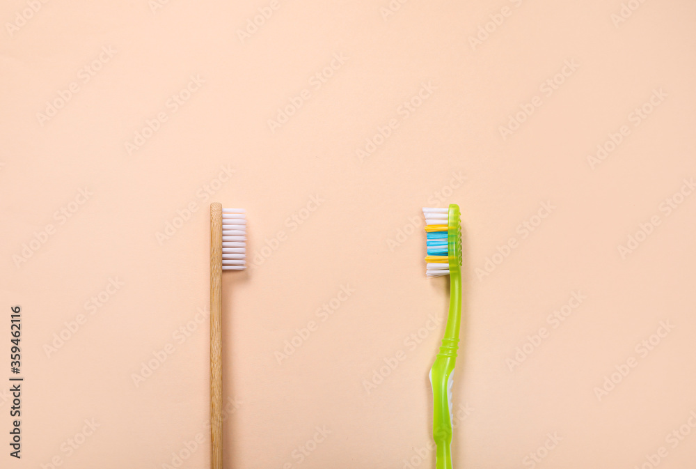 Wooden and plastic toothbrushes, ecological concept Wooden and plastic toothbrushes, ecological concept