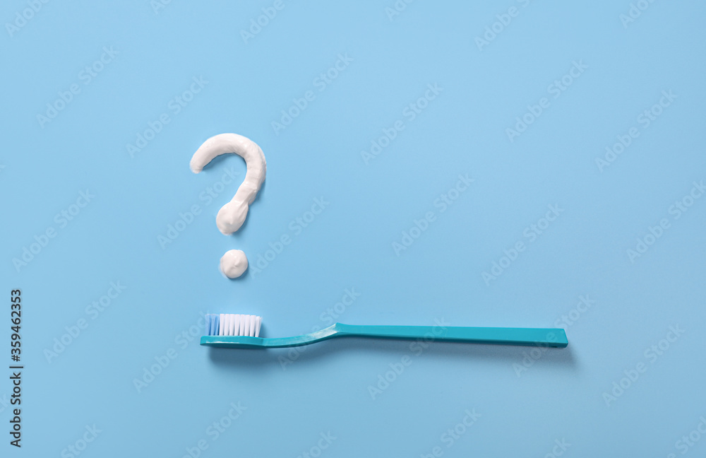 Plastic toothbrushes with toothpaste question mark Plastic toothbrushes with toothpaste question mark