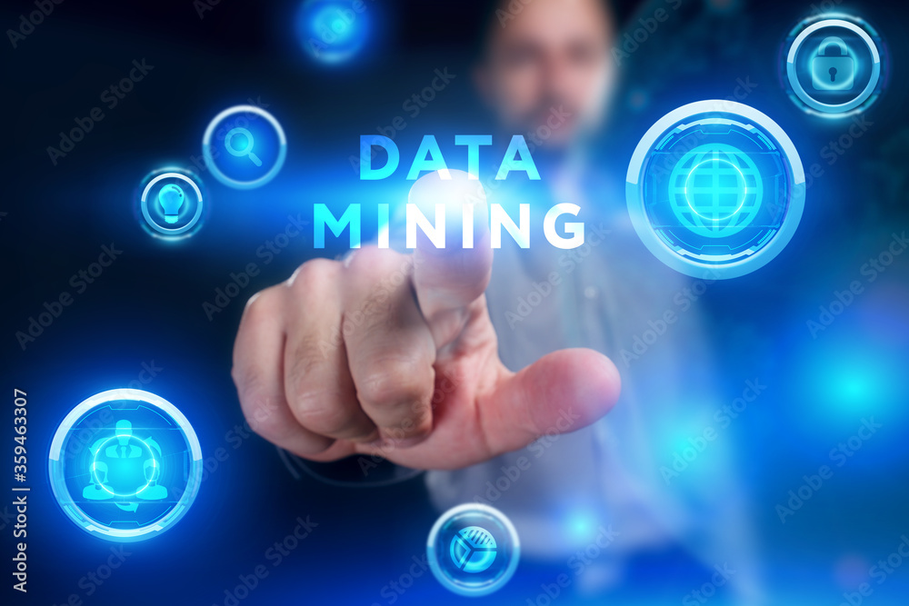Business, Technology, Internet and network concept. Young businessman working on a virtual screen of the future and sees the inscription: Data mining Business, Technology, Internet and network concept. Young businessman working on a virtual screen of the future and sees the inscription: Data mining