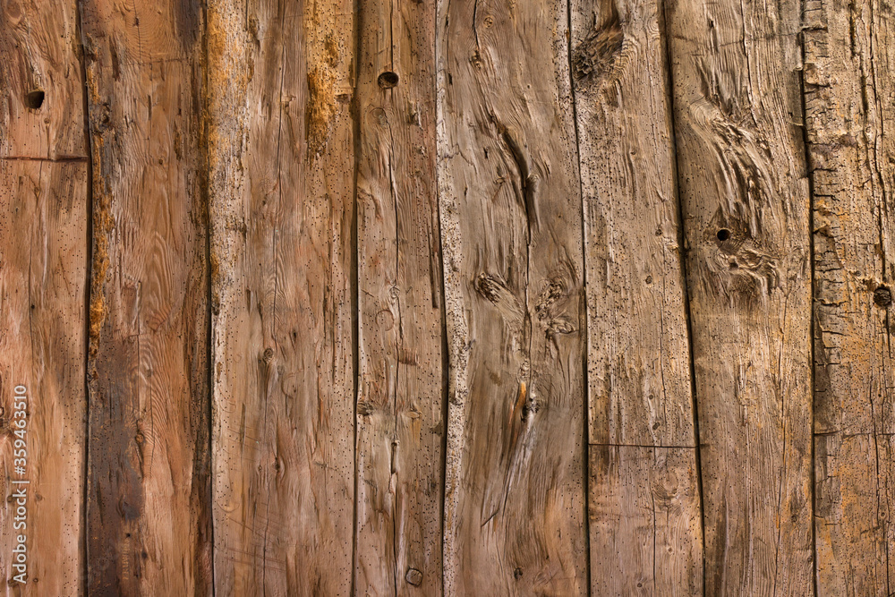 Natural rustic brown barn wood wall. Wall texture background pattern. Natural rustic brown barn wood wall. Wall texture background pattern.