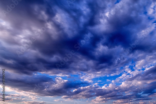 Εκτύπωση καμβά Background of the black and white cumulus clouds under the beautiful blue sky