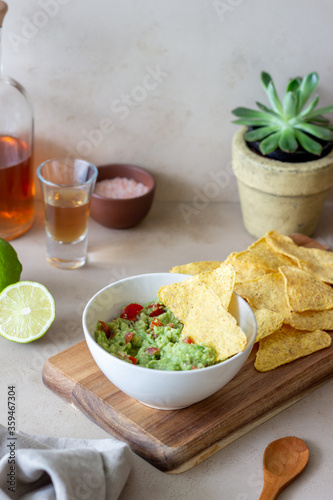 Mexican dip sauce guacamole with nachos chips. Mexican food. Healthy eating. Vegetarian food.