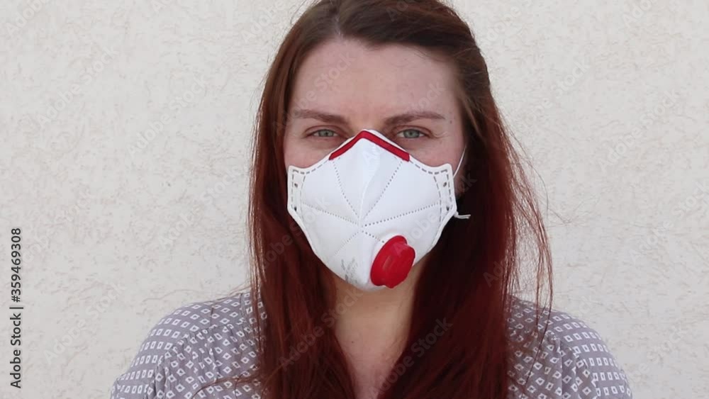 Young woman in mask ffp3 as a individual protection device against coronavirus. Protection. Conavirus and Covid-19 Concet