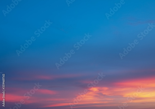 Background of colorful sky concept: Dramatic sunset with twilight color sky and clouds