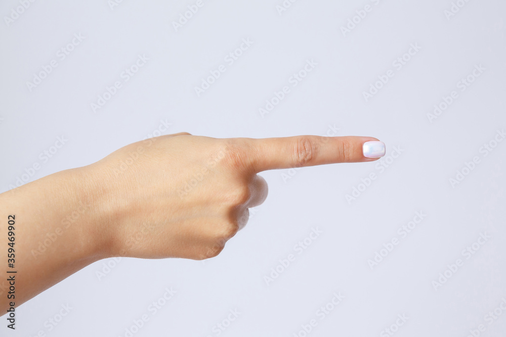 Gesture and sign, female hand on a white background. Fingers showing Gesture and sign, female hand on a white background. Fingers showing