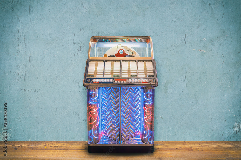 Ταπετσαρία Colorful vintage jukebox in front of a blue weathered wall