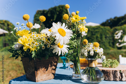 Beautiful bouquet from wildflowers. A bouquet of daisies in yellow and white.