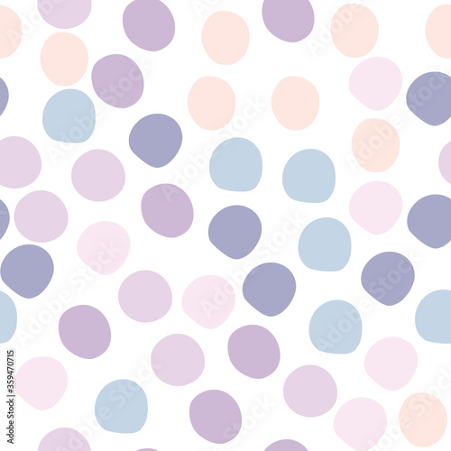 Cute colored polka dots seamless pattern on white background. Funny wallpaper.