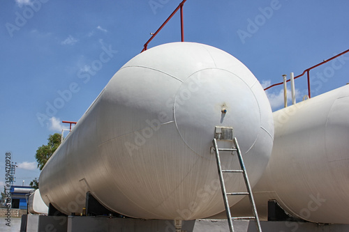 A pressure vessel constructed of a horizontal steel cylinder (LPG Storage, In the United States ASME Boiler and Pressure Vessel Code, Ad Merkblatt design). Pressure must be built to a formal code. photo