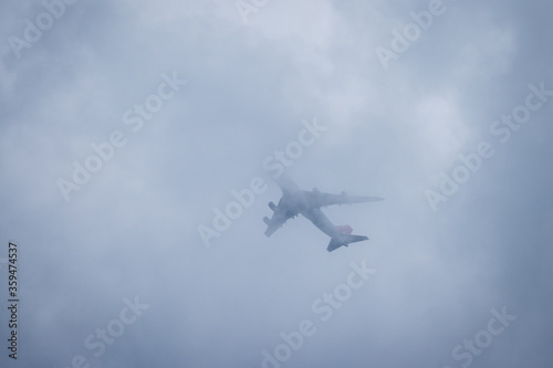 airplane in dust and dark clouds