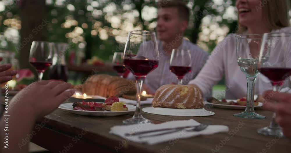 Young group of people having vine beside river in the countryside enjoying happy moments - celebration in nature Young group of people having vine beside river in the countryside enjoying happy moments - celebration in nature