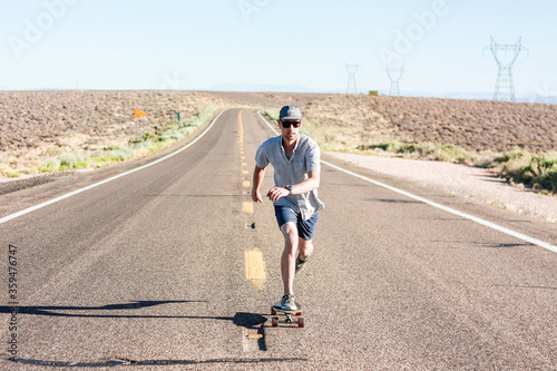 Man skateboarding on an open road
