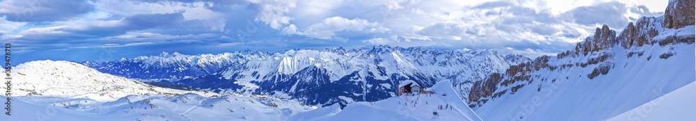 Panoramic picture of Ifen ski lift mountain station at daytime with blue skies in winter during skiing season