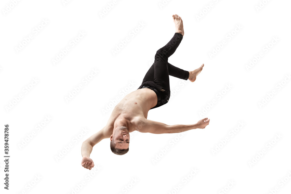 Mid-air beauty cought in moment. Full length shot of young man hovering in air and keeping eyes closed. Levitating in free falling, lack of gravity, flying. Freedom, emotions, artwork concept.