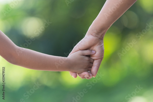 hand hold mom Concept Love the giver Of mothers with children On blurred background nature  © photosky99