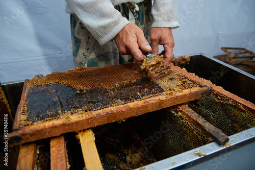 pumping and collecting honey in an apiary in a mechanical honey extractor