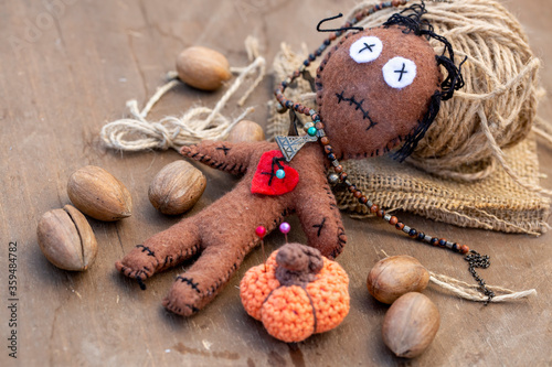 Voodoo Doll on a wooden bac...