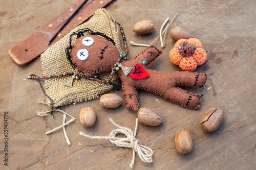 Voodoo Doll on a wooden bac...