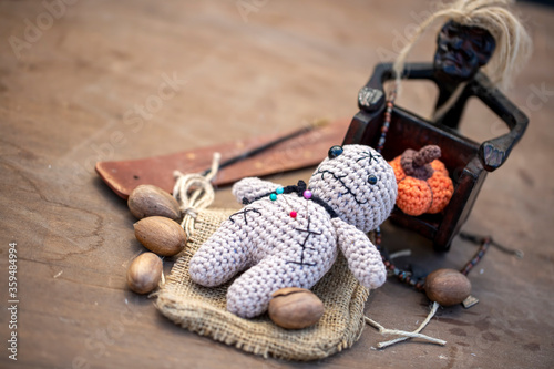 Voodoo Doll on a wooden bac...