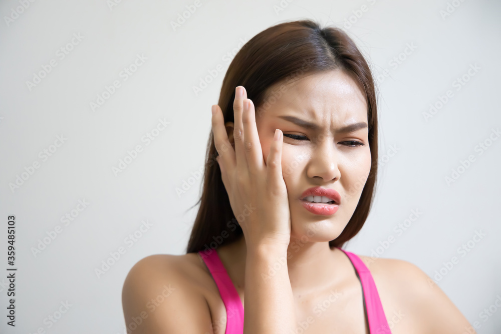 woman with toothache; sick asian woman suffering from toothache, tooth decay, tooth sensitivity, wisdom tooth pain, cavity, dental care concept; young adult asian woman model woman with toothache; sick asian woman suffering from toothache, tooth decay, tooth sensitivity, wisdom tooth pain, cavity, dental care concept; young adult asian woman model