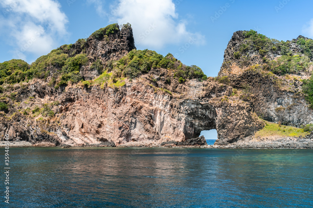 Beautiful view of the Ponta da Sapata rocks from the sea at Fernando de Noronha, a Unesco World Heritage site, Pernambuco, Brazil