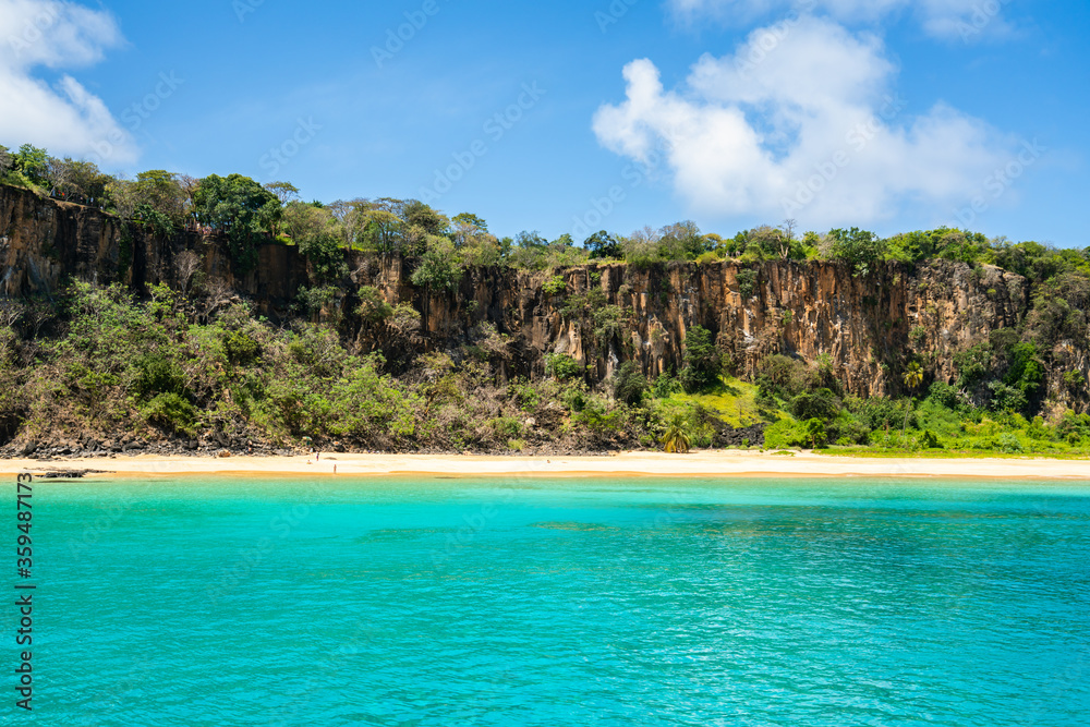 The Beautiful view of Sancho Beach from the sea, with turquoise clear water, at Fernando de Noronha Marine National Park, a Unesco World Heritage site, Pernambuco, Brazil