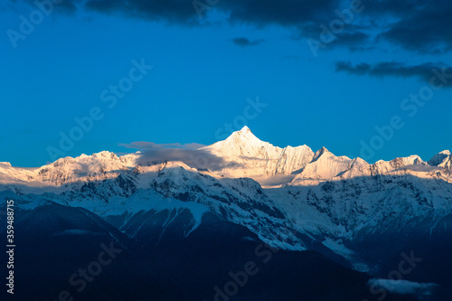 Sunrise at Snow Mountain Meili, a sacred mountain in Tibet, China.