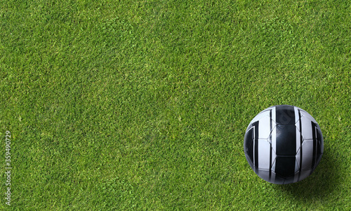 Soccer ball on grass background