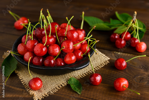 Sweet cherries in a black bowl