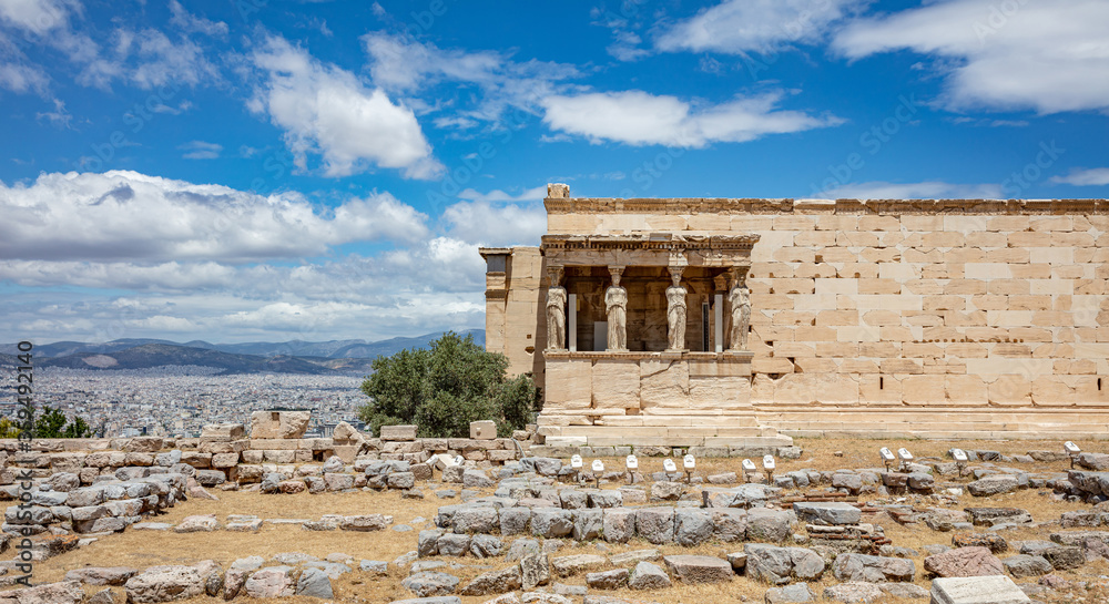 Athens, Greece. Erechtheion with Caryatid Porch on Acropolis hill, blue sky background
