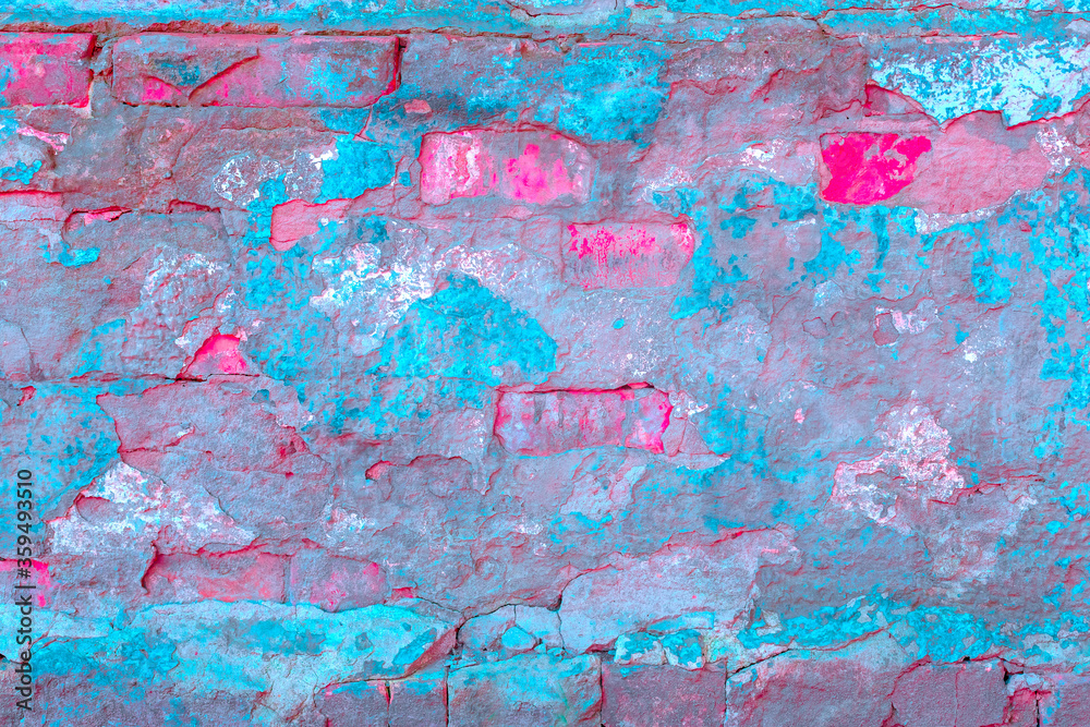 Old concrete wall covered with colorful paint