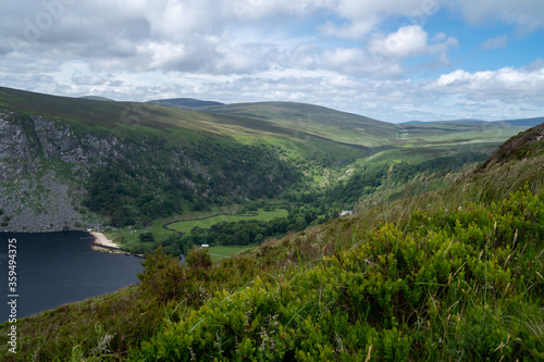Panoramic view of  The Guinness Lake (Lough Tay) -  a movie and series location, such as Vikings. Close to Dublin City, popular tourist destination. © Marcin