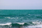 Turquoise waves in the sea. Sea view