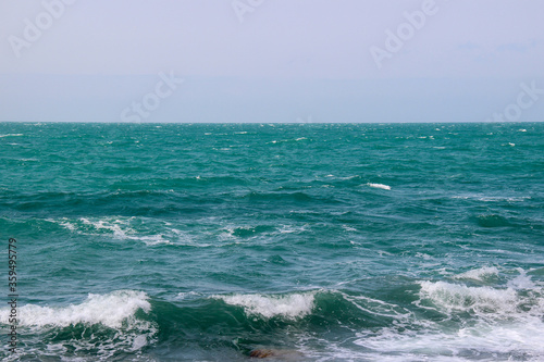 Turquoise waves in the sea. Sea view