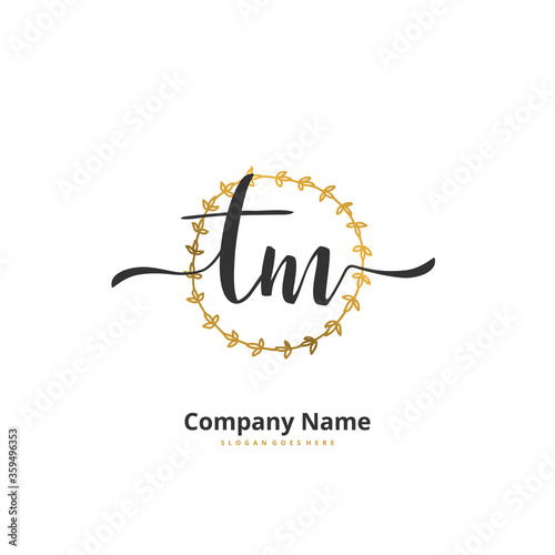 T M TM Initial handwriting and signature logo design with circle. Beautiful design handwritten logo for fashion, team, wedding, luxury logo.