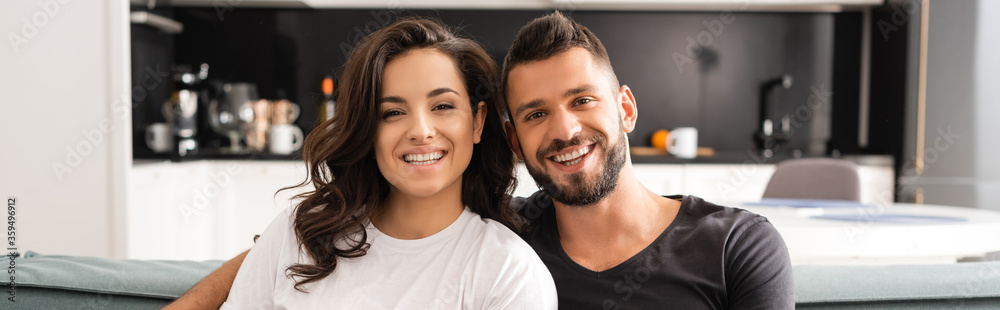 website header of happy young couple looking at camera website header of happy young couple looking at camera