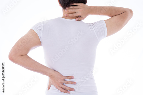 A man feeling exhausted and suffering from neck and back pain and injury on isolated white background. Health care and medical concept.