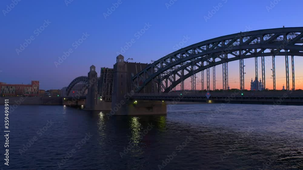 The Bolsheokhtinsky Bridge is a beautiful drawbridge across the Neva River in St. Petersburg. White Nights. The Bridge of Peter the Great. The Bolsheokhtinsky Bridge is a beautiful drawbridge across the Neva River in St. Petersburg. White Nights. The Bridge of Peter the Great.