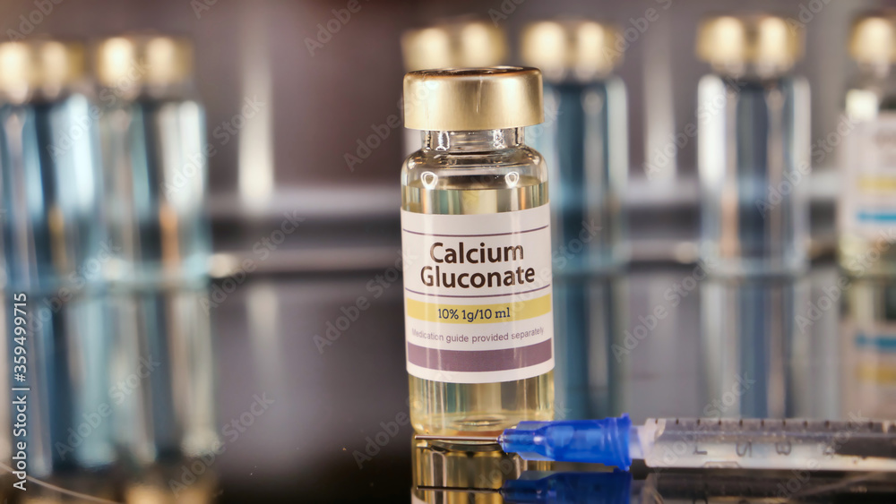 Vial of Calcium Gluconate stainless steel background Vial of Calcium Gluconate stainless steel background